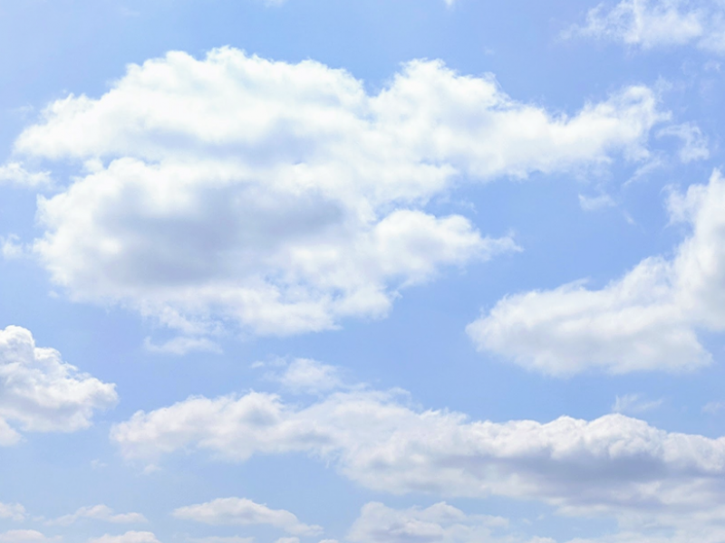 Photograph of clouds in a blue sky